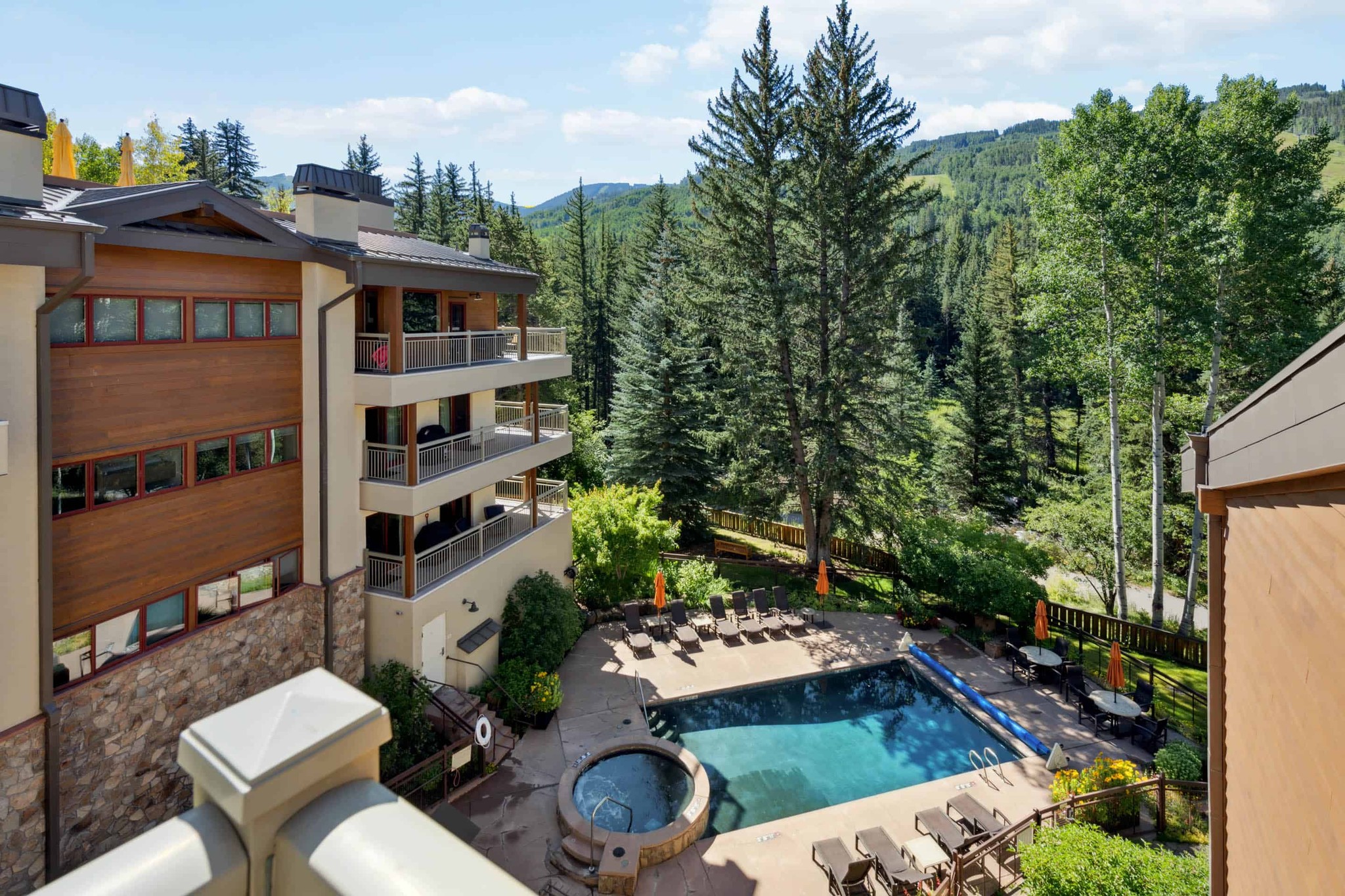 balcony view overseeing lodge at Lionshead pool and mountains