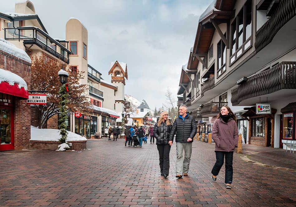 Family in Vail Village in the winter. Apres Ski